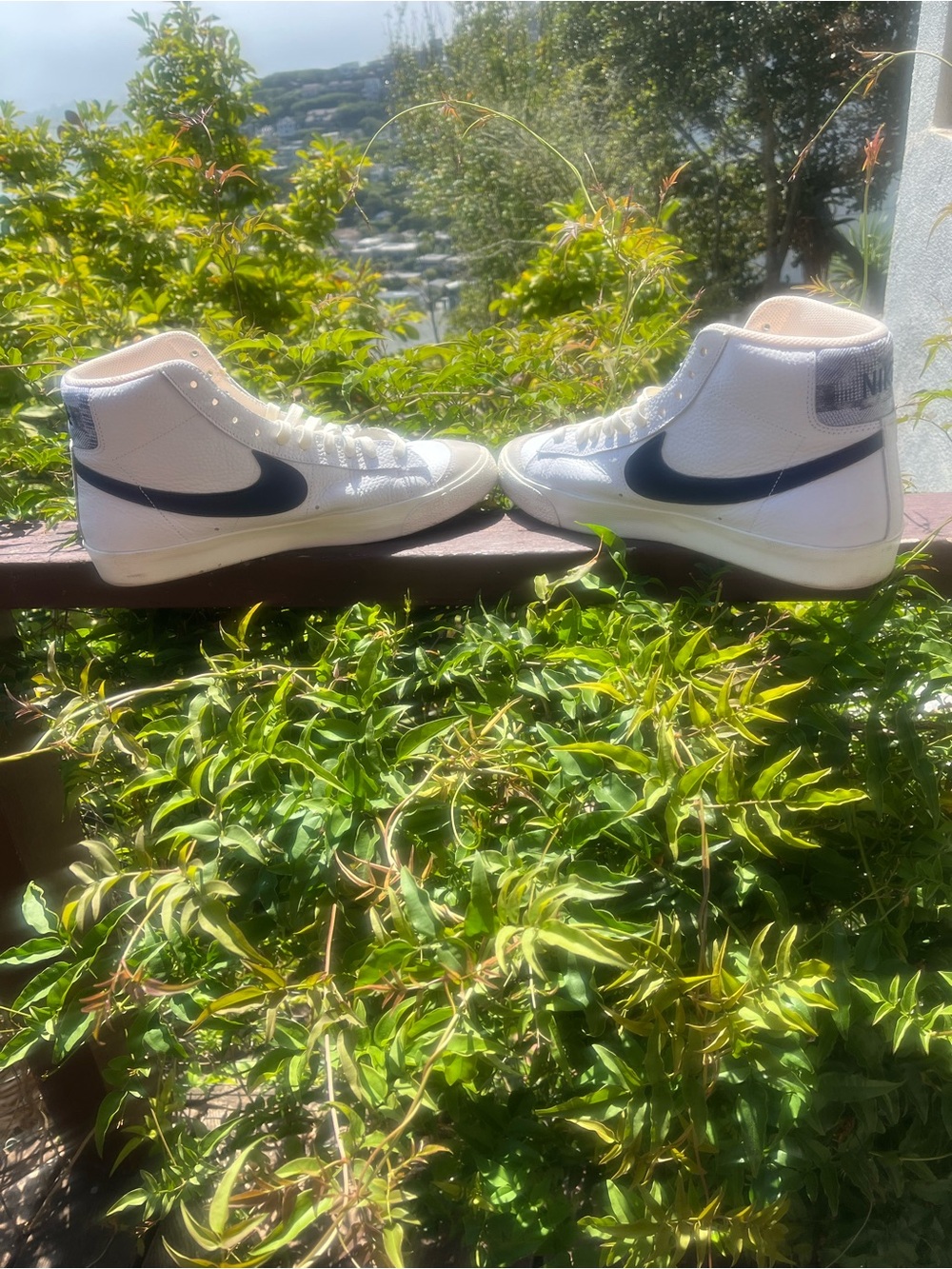Nike White High-Top Sneakers with Navy Blue Swoosh Accents